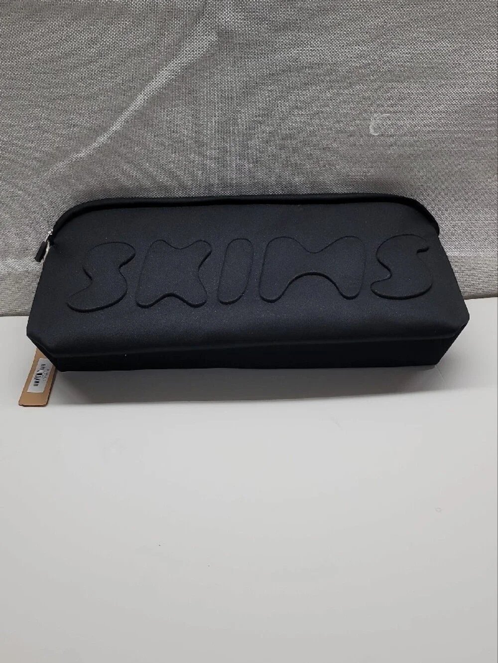 SKIMS Neoprene Cosmetic Black Embossed Logo Zip Pouch